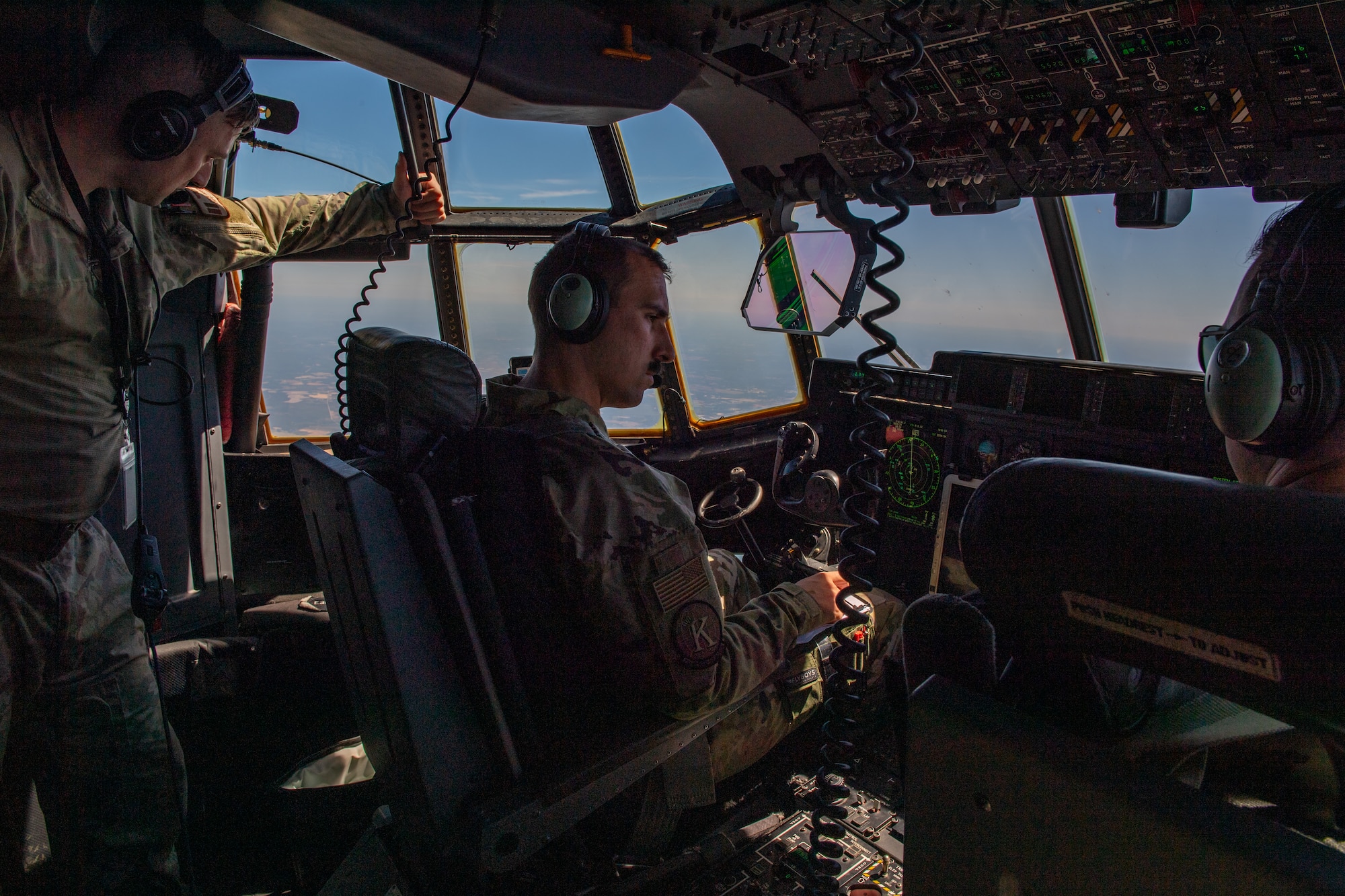 U.S. Air Force Capt. Jonathan Romanko, 71st Rescue Squadron pilot, flies an HC-130J Combat King II during Exercise Ready Tiger 24-1, April 12, 2024. The exercise simulated a downed pilot scenario which tested the combat search and rescue team’s ability to respond at a moment's notice. During Ready Tiger 24-1, exercise inspectors will assess the 23rd Wing's proficiency in employing decentralized command and control to fulfill air tasking orders across geographically dispersed areas amid communication challenges, integrating Agile Combat Employment principles such as integrated combat turns, forward aerial refueling points, multi-capable Airmen, and combat search and rescue capabilities. (U.S. Air Force photo by Senior Airman Courtney Sebastianelli)