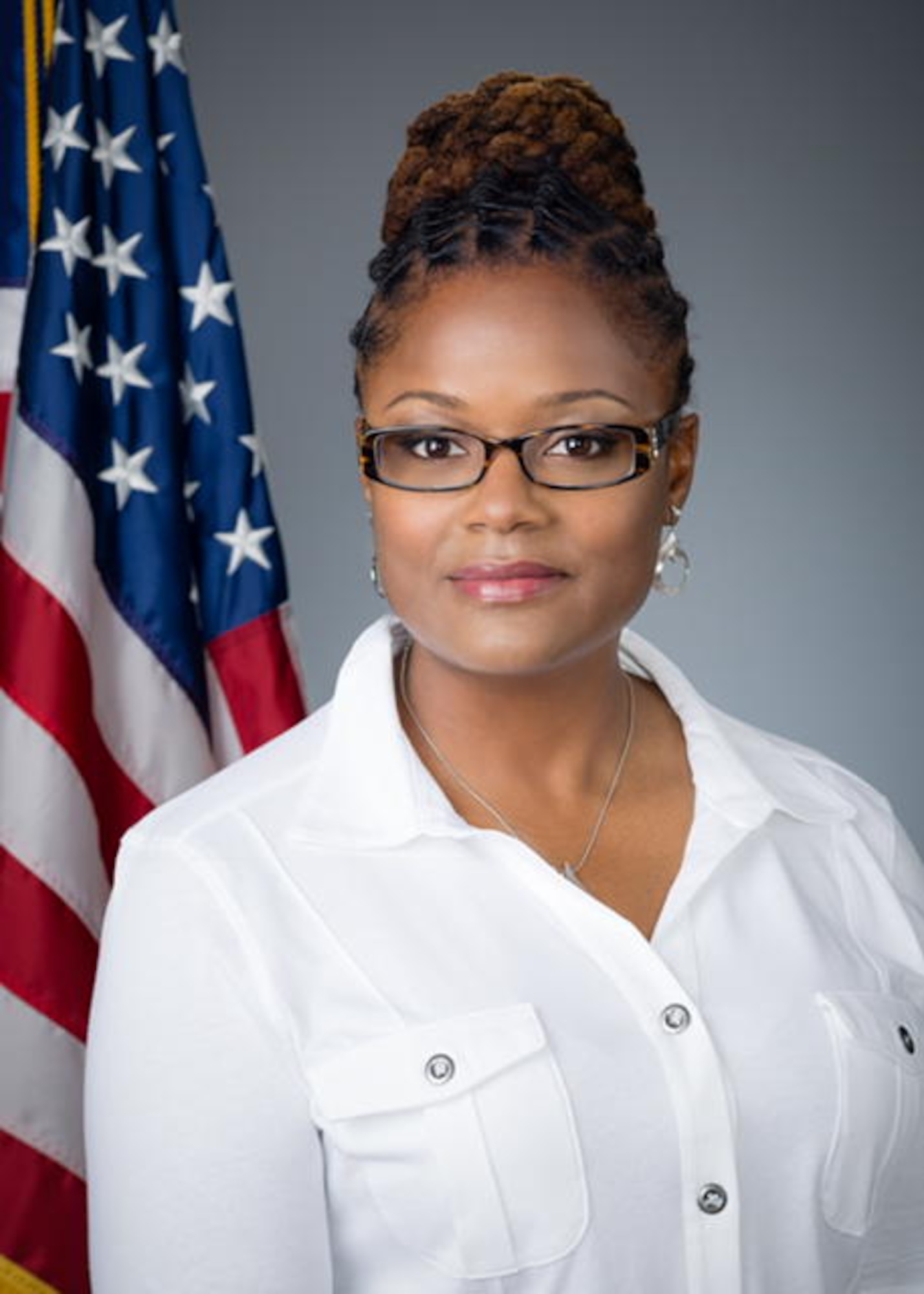 Professional studio photo of Westover’s Sexual Assault Response Coordinator Tamara Thompson, who is standing in front of an American flag.
