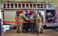The ribbon gets cut to officially open the new fire truck maintenance facility at Eglin Air Force Base, Florida.  The maintenance mission conveniently relocated into an inactive fire station near the 33rd Fighter Wing.  (Courtesy photo)