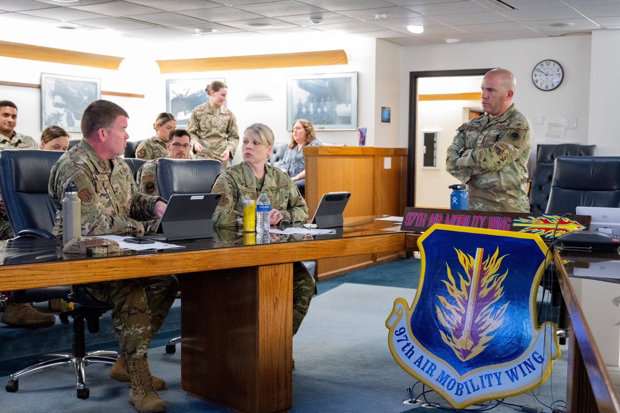 U.S. Air Force Col. Daniel Roberts, left, 97th Medical Group (MDG) commander, explains problems the MDG faces at Altus Air Force Base, Oklahoma, April 15, 2024. Integrating a new time card system for the MDG is one innovation that was pitched at the event. (U.S. Air Force Photo by Airman 1st Class Jonah G. Bliss)