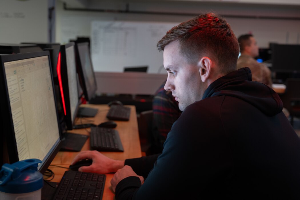 Senior Airman Kaleb Weinkauf, 22nd Airlift Squadron flight engineer, learns how to design objects to be 3D printed.