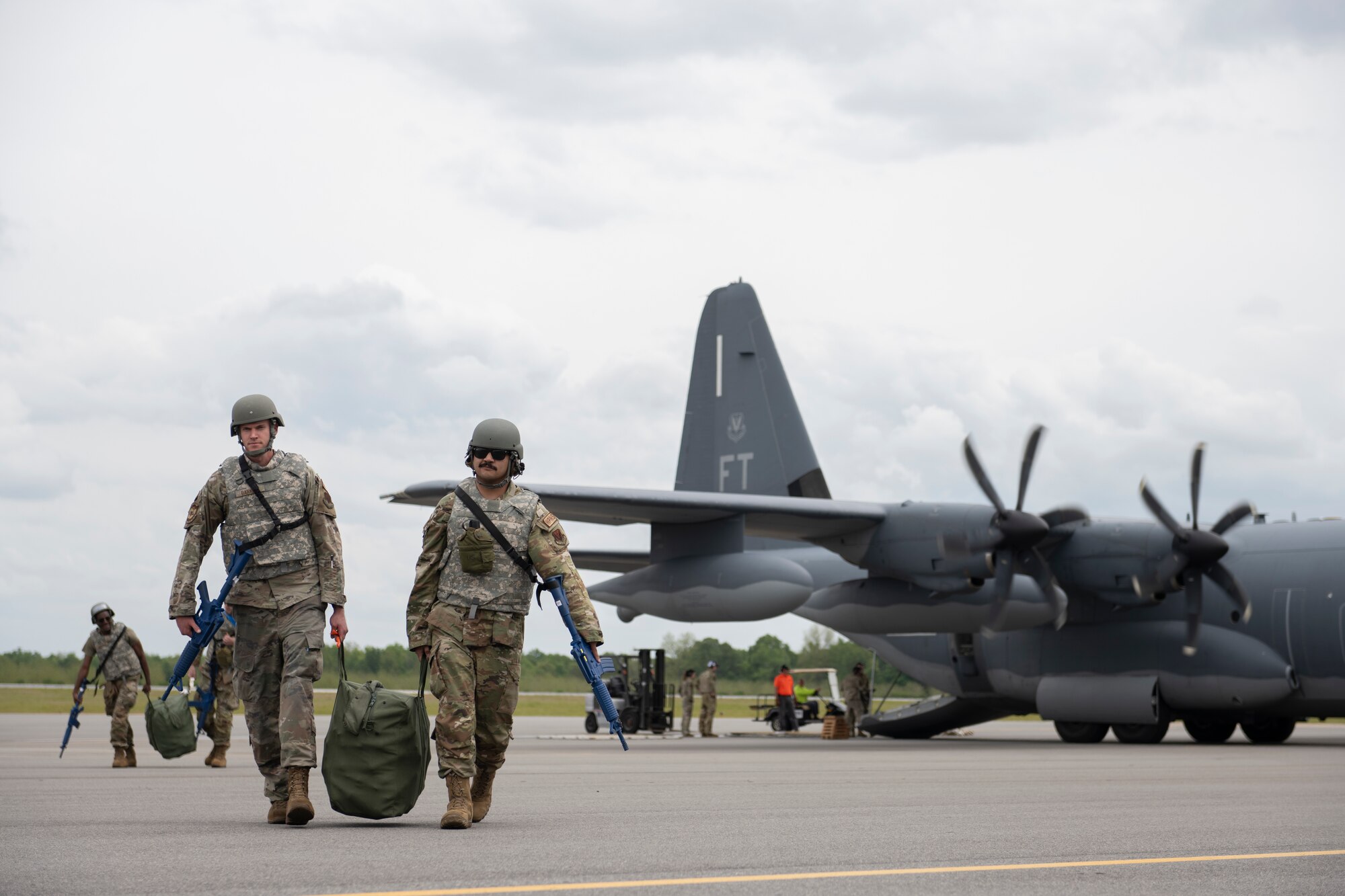 U.S. Air Force Airmen assigned to the 23rd Wing unload an HC-130J Combat King II at Perry-Houston County Airport, Georgia, April 10, 2024. As part of Exercise Ready Tiger 24-1, personnel forward-deployed to a contingency location to conduct hot-pit refueling on A-10C Thunderbolt II aircraft. During Ready Tiger 24-1, the 23rd Wing will be evaluated on the integration of Air Force Force Generation principles such as Agile Combat Employment, integrated combat turns, forward aerial refueling points, multi-capable Airmen, and combat search and rescue capabilities. (U.S. Air Force photo by Senior Airman Rachel Coates)