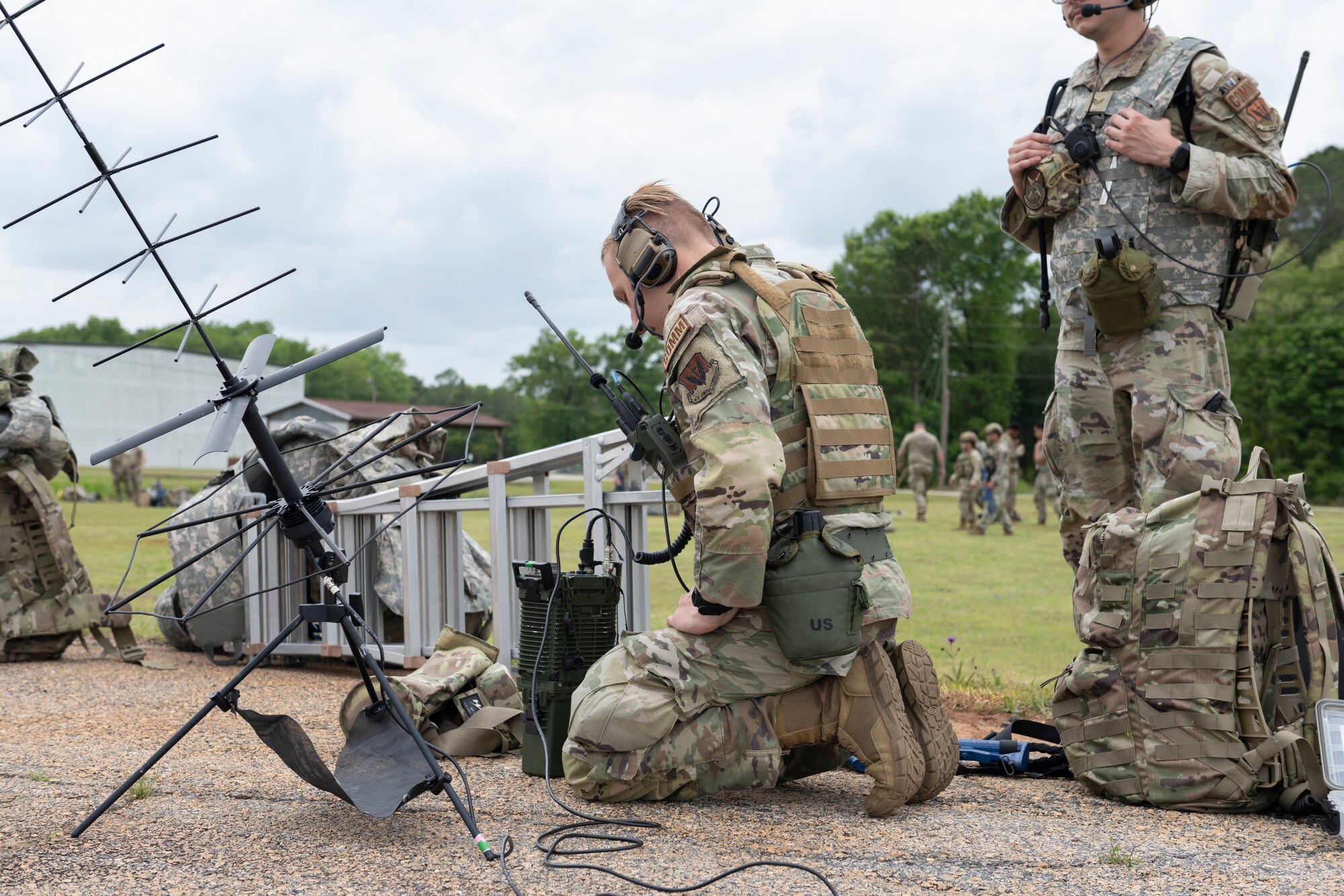 U.S. Air Force Airman Ethan Issacs, 23rd Communications Squadron radio frequency technician, sets up satellite communications for Exercise Ready Tiger 24-1 at Perry-Houston County Airport, Georgia, April 10, 2024. The satellite communications can reach anywhere across the world, enabling the collection of data to employ forces on identified targets and threats. During Ready Tiger 24-1, the 23rd Wing will be evaluated on the integration of Air Force Force Generation principles such as Agile Combat Employment, integrated combat turns, forward aerial refueling points, multi-capable Airmen, and combat search and rescue capabilities. (U.S. Air Force photo by Senior Airman Rachel Coates)