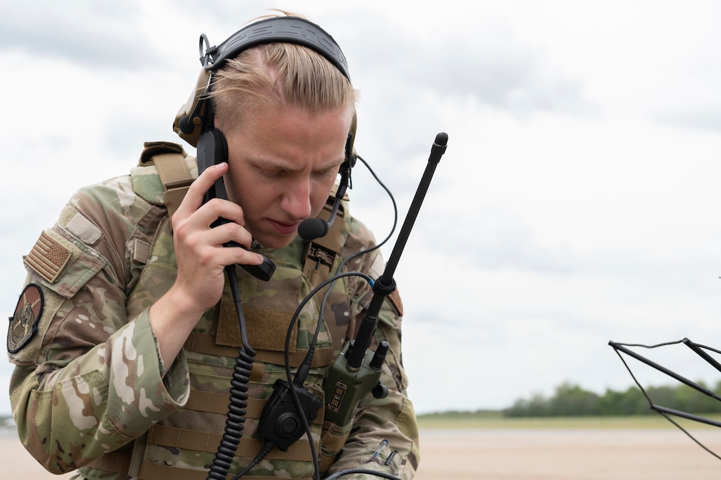 U.S. Air Force Airman Ethan Issacs, 23rd Communications Squadron radio frequency technician, sets up satellite communications for Exercise Ready Tiger 24-1 at Perry-Houston County Airport, Georgia, April 10, 2024. Issacs communicated with Avon Park Air Force Range personnel to complete a radio check. During Ready Tiger 24-1, the 23rd Wing will be evaluated on the integration of Air Force Force Generation principles such as Agile Combat Employment, integrated combat turns, forward aerial refueling points, multi-capable Airmen, and combat search and rescue capabilities. (U.S. Air Force photo by Senior Airman Rachel Coates)