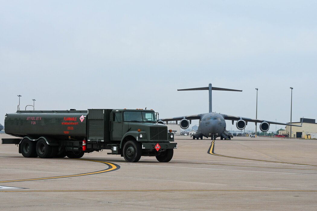 An R-11 truck from the 97th Logistic Readiness Squadron Fuels Management Flight drives on the flightline at Altus Air Force Base, Oklahoma, April 15, 2024. The R-11 is a 6,000 gallon tank refueler used to complete minimal fuel loads. (U.S. Air Force photo by Senior Airman Trenton Jancze)