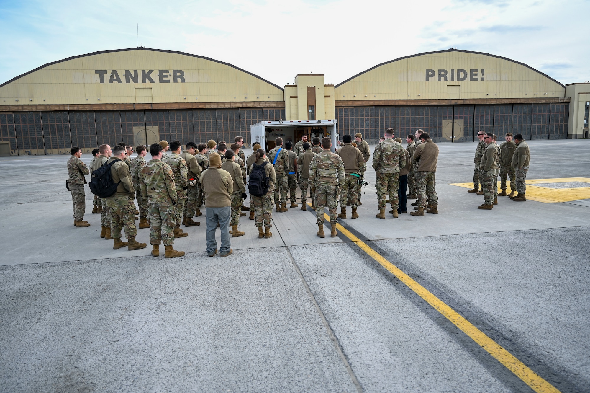 Airmen listen to instruction