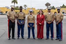 Staff from Congresswoman Sara Jacobs' office, right center, poses for a photograph with U.S. Marine Corps Pfc. Aidee Calero, left center, at her recruit training graduation at Marine Corps Recruit Depot San Diego in San Diego, April 12. Calero spent nearly seven months at recruit training due to an injury. Jacobs is the U.S. representative for California's 51st Congressional District. (U.S. Marine Corps photo by Sgt. Christian Bunch)