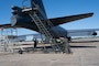 Senior Airman Justin Whitehead, 2nd Aircraft Maintenance Squadron crew chief, Capt. Joshua Benard, 20th Bomb Squadron radar navigator, and Capt. Stephen O’Donnell, 20th Bomb Squadron electron warfare navigator, line up stairs to a B-52H Stratofortress as they prepare to load a drag chute at Chennault International Airport, La., April 12, 2024. This was part of exercise Bayou Vigilance, which is held to enhance safety, security, and reliability of the bomber leg of the U.S. nuclear triad. (U.S. Air Force photo by Senior Airman Nicole Ledbetter)