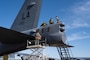 Senior Airman Justin Whitehead, 2nd Aircraft Maintenance Squadron crew chief, Capt. Joshua Benard, 20th Bomb Squadron radar navigator, and Capt. Stephen O’Donnell, 20th Bomb Squadron electron warfare navigator, prepare to load a drag chute into a B-52H Stratofortress after landing at Chennault International Airport, La., during exercise Bayou Vigilance April 12, 2024. This exercise was conducted with a focus on the safe and secure handling of assets and capabilities that comprise the nuclear triad. (U.S. Air Force photo by Senior Airman Nicole Ledbetter)
