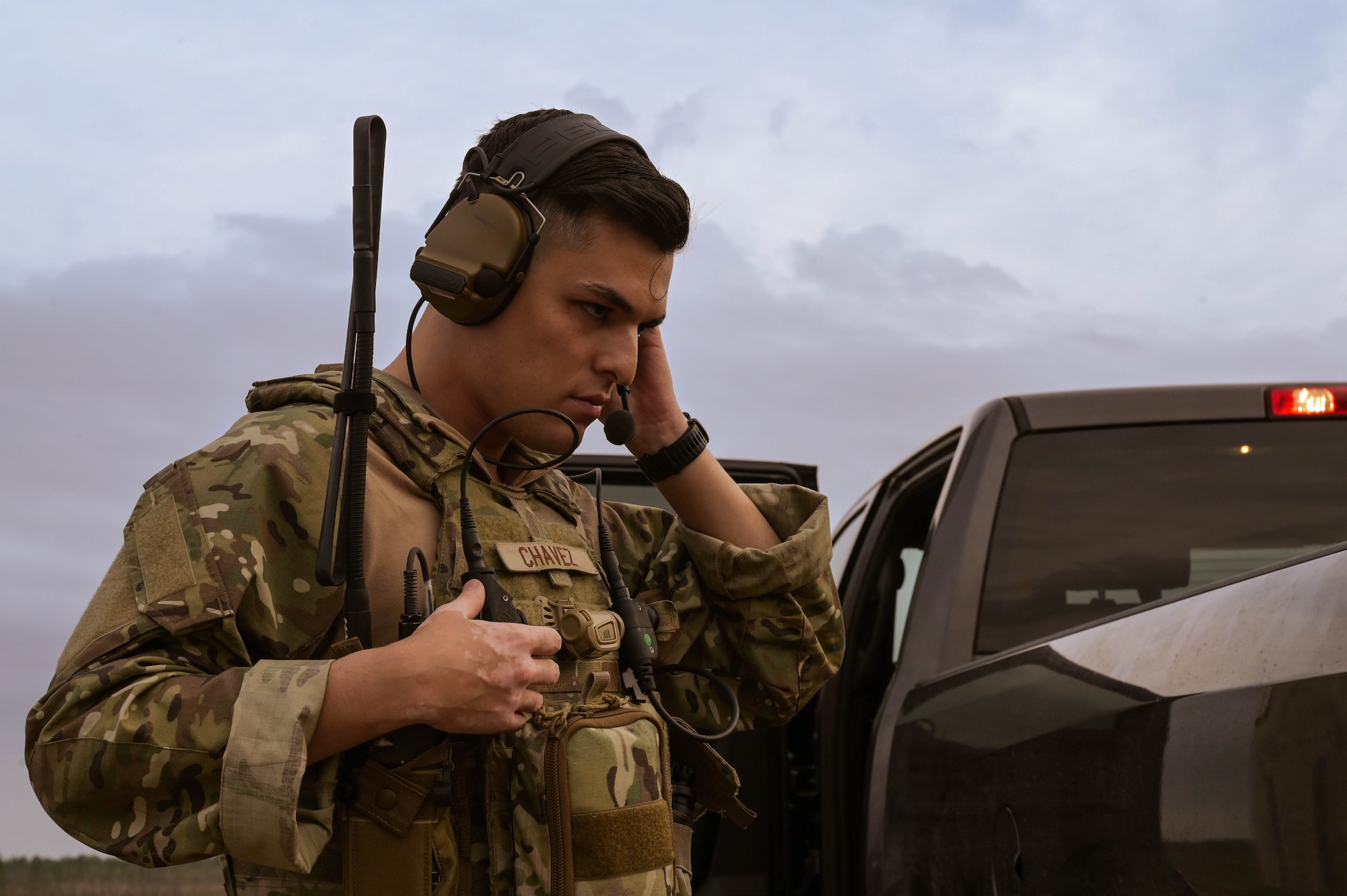 U.S. Air Force Senior Airman Daniel Chavez, a 1st Special Operations Wing special mission planner, adjusts his gear during Exercise Emerald Warrior Spiral at the Eglin Range, Florida, April 9, 2024.