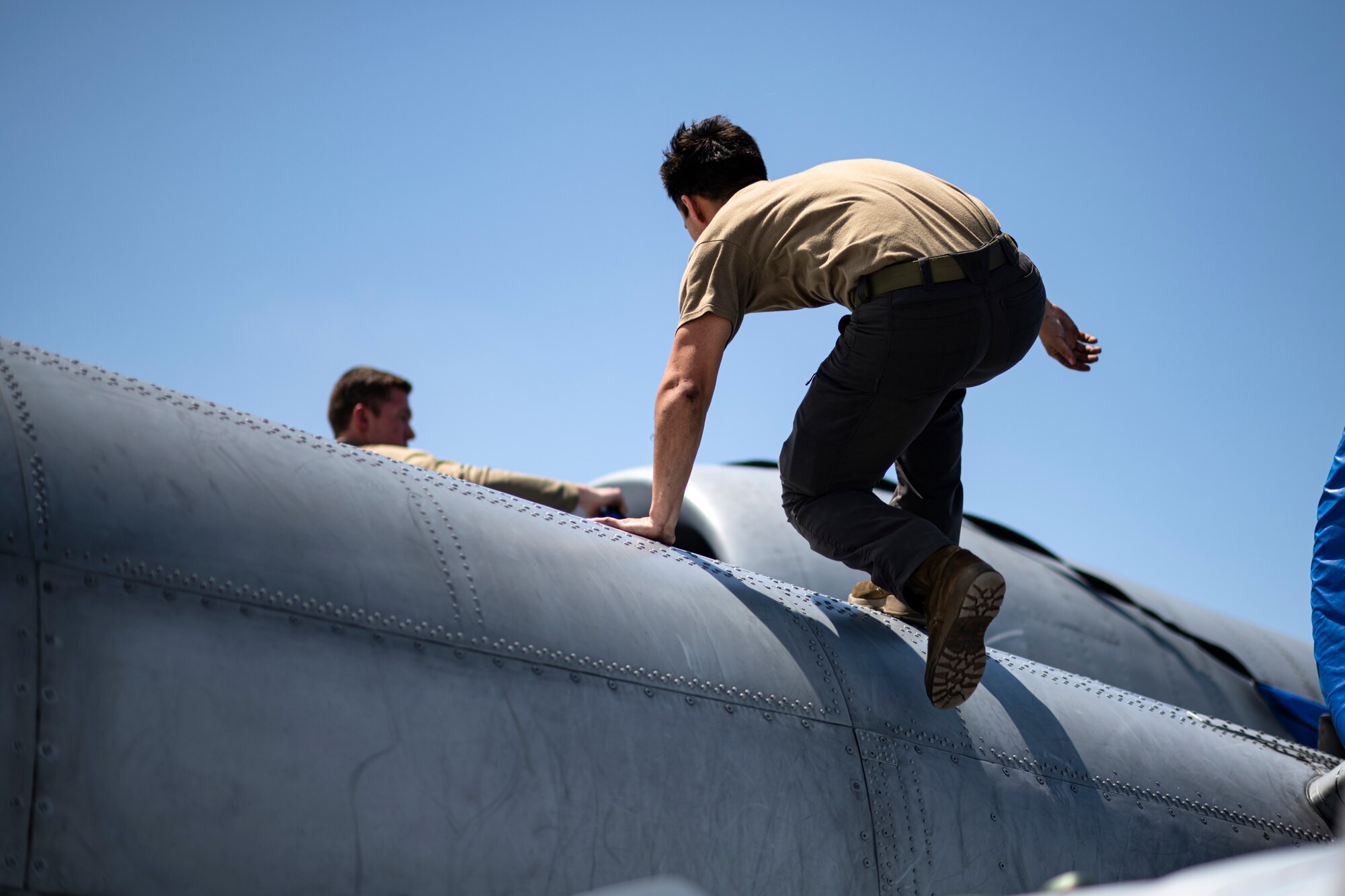 U.S. Air Force Airmen assigned to the 74th Fighter Generation Squadron secure engine covers on an A-10C Thunderbolt II during Exercise Ready Tiger 24-1 at Avon Park Air Force Range, Florida, April 10, 2024. The 74th FGS responded to exercise scenarios, ensuring A-10C Thunderbolt II aircraft could continue their mission in providing combat airpower. During  Ready Tiger 24-1, exercise inspectors will assess the 23rd Wing's proficiency in employing decentralized command and control to fulfill air tasking orders across geographically dispersed areas amid communication challenges, integrating Agile Combat Employment principles such as integrated combat turns, forward aerial refueling points, multi-capable Airmen, and combat search and rescue capabilities. (U.S. Air Force photo by Tech. Sgt. Devin Boyer)