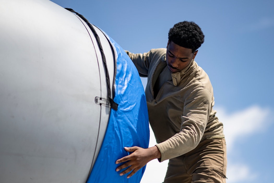 A U.S. Air Force Airman assigned to the 74th Fighter Generation Squadron secures an engine cover on an A-10C Thunderbolt II during Exercise Ready Tiger 24-1 at Avon Park Air Force Range, Florida, April 10, 2024. The 74th FGS was crucial in generating combat airpower at various dispersed locations in a simulated Indo-Pacific region. During Ready Tiger 24-1, exercise inspectors will assess the 23rd Wing's proficiency in employing decentralized command and control to fulfill air tasking orders across geographically dispersed areas amid communication challenges, integrating Agile Combat Employment principles such as integrated combat turns, forward aerial refueling points, multi-capable Airmen, and combat search and rescue capabilities. (U.S. Air Force photo by Tech. Sgt. Devin Boyer)