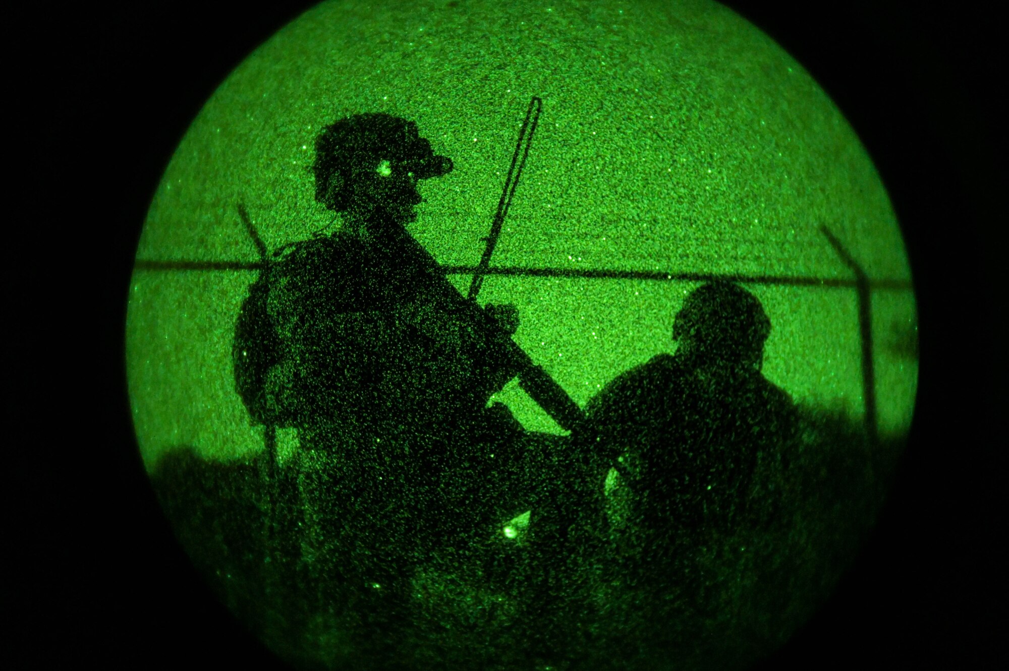 U.S. Air Force Tech. Sgt. Tyler Dugan, the 1st Special Operations Wing non-commissioned officer in charge of special missions planning, and A Swedish Special Forces Command member participate in Exercise Emerald Warrior Spiral at the Eglin Range, Florida, April 11, 2024.