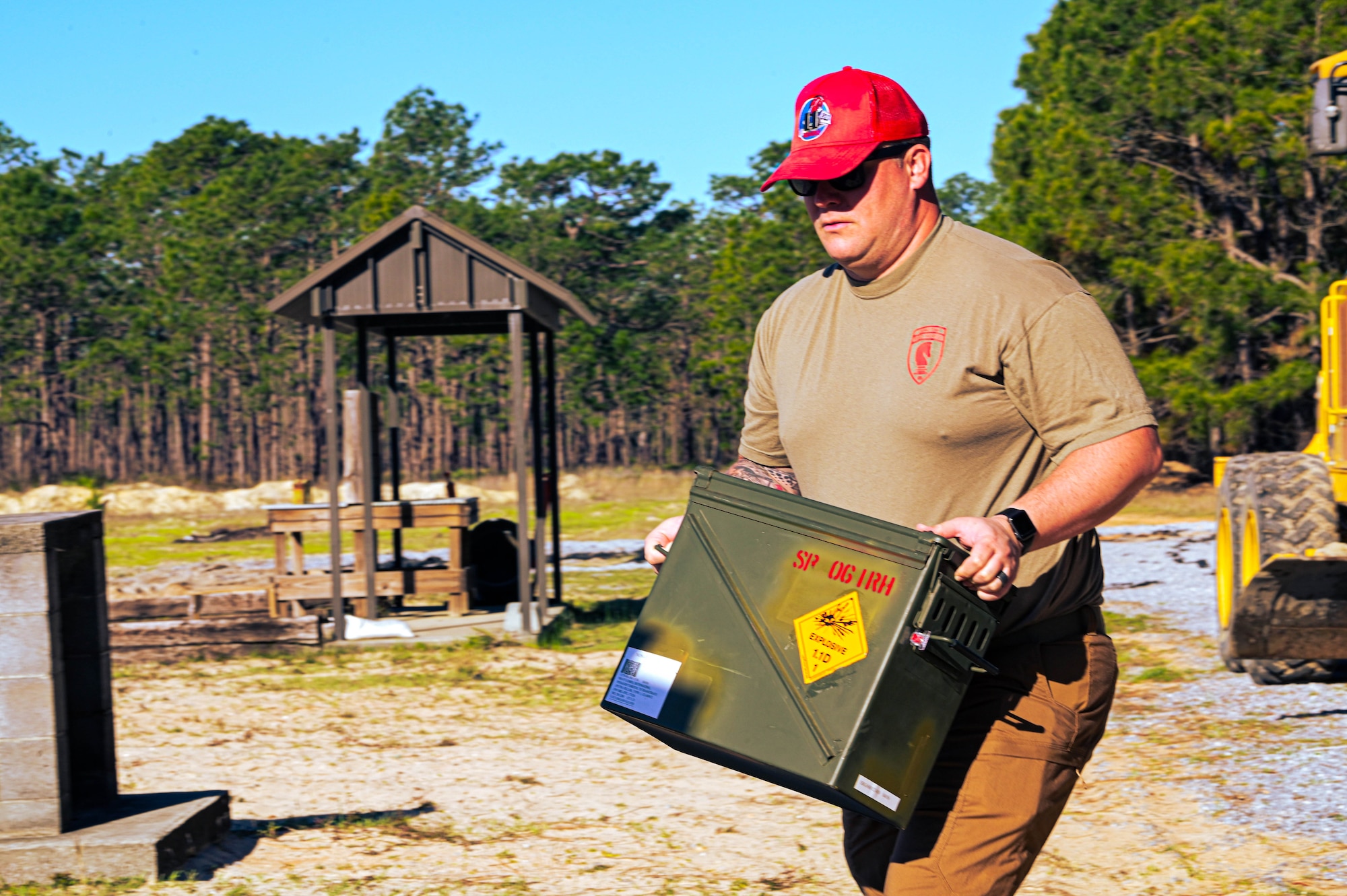 U.S. Air Force Capt. Sean Melcher, the 823rd Red Horse Squadron officer in charge of demolition operations, carries explosives during demolition training at Hurlburt Field, Florida, March 28, 2024.