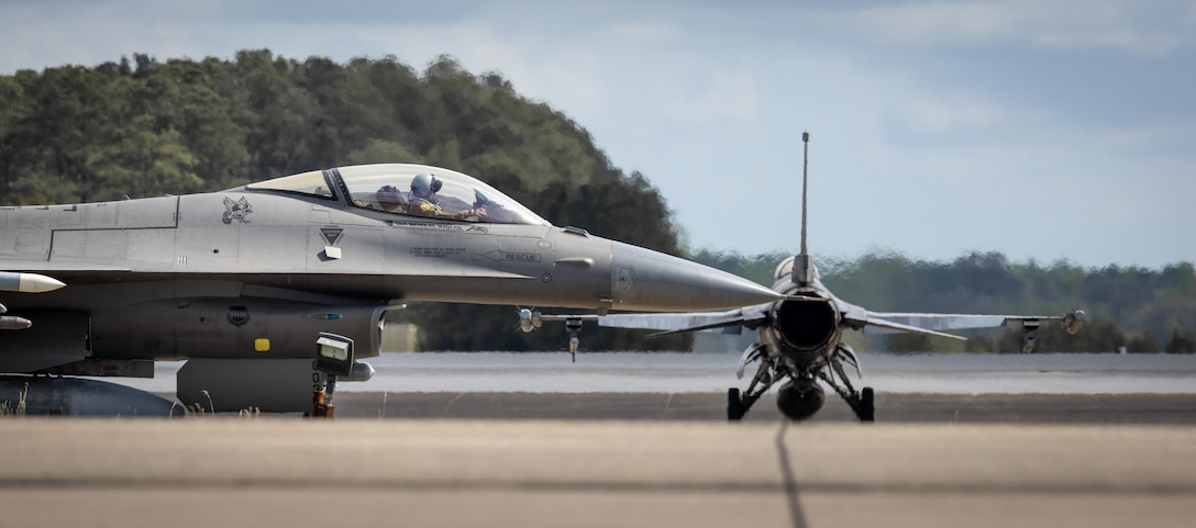 A U.S. Air Force F-16 Fighting Falcon, with the 20th Fighter Wing from Shaw Air Force Base, South Carolina, taxis to the runway at Marine Corps Air Station Cherry Point, North Carolina, April 10, 2024. The aircraft were conducting training exercises off the coast of North Carolina and landed at MCAS Cherry Point for refueling. MCAS Cherry Point hosts several different aircraft to support diverse types of operations and training to enhance the Department of Defense global readiness and effectiveness. (U.S. Marine Corps photo by Lance Cpl. Matthew Williams)