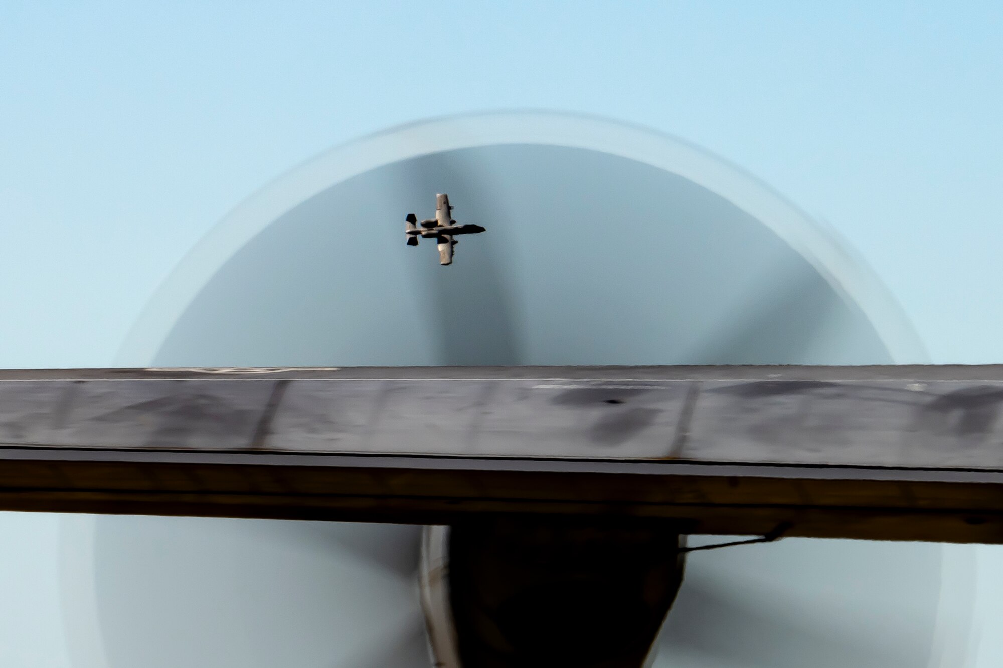 An A-10C Thunderbolt II assigned to the 74th Fighter Squadron flies over an HC-130J Combat King II assigned to the 71st Rescue Squadron on the flight line at Avon Park Air Force Range, Florida, during Exercise Ready Tiger 24-1, April 12, 2024. The 74th FS provided support for the 71st RQS’ combat search and rescue operations in a simulated Indo-Pacific region. The Ready Tiger 24-1 exercise evaluators will assess the 23rd Wing's proficiency in employing decentralized command and control to fulfill air tasking orders across geographically dispersed areas amid communication challenges. (U.S. Air Force photo by Tech. Sgt. Devin Boyer)