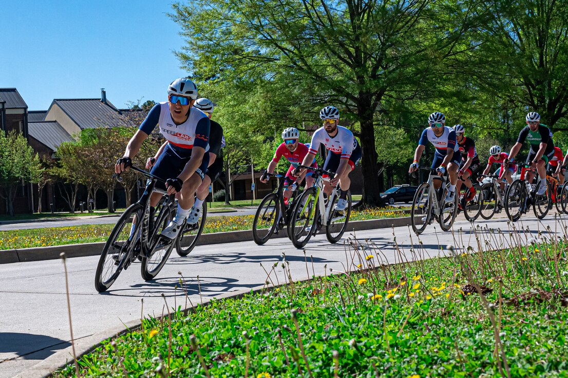 Cyclists race down Anderson street during the second annual Fort Eustis Circuit Race at Joint Base Langley-Eustis, Virginia, April 14, 2024. The race is part of “Tour of Newport News,” a three-day event the City of Newport News’ Parks & Rec., Department hosts in an effort to further grow Mid-Atlantic racing. 