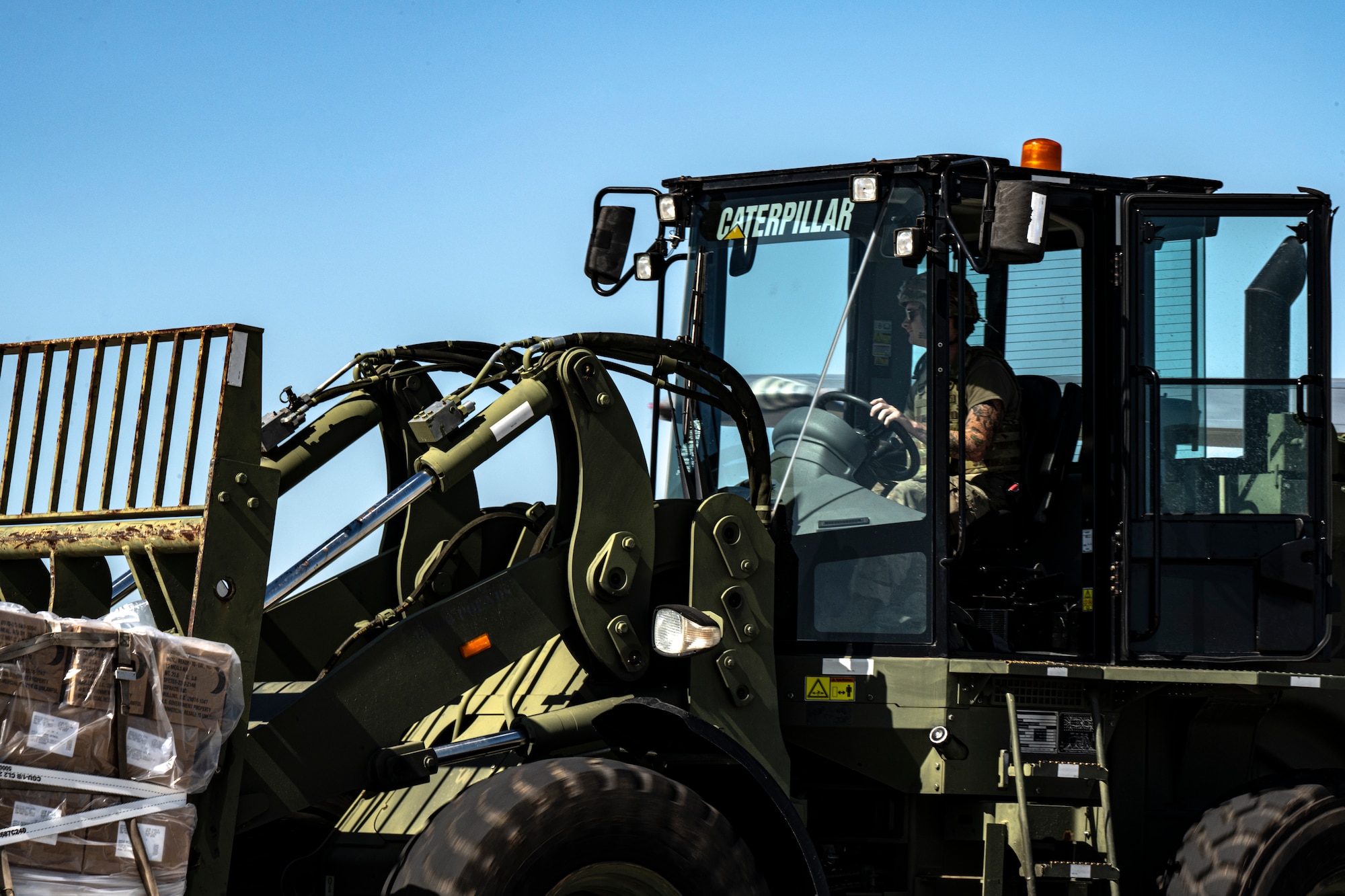 U.S. Air Force Senior Airman Calvin Newvine, 23rd Logistics Readiness Squadron air transportation technician, transports Meals-Ready-To-Eat from an HC-130J Combat King II to the base at Avon Park Air Force Range, Florida, during Exercise Ready Tiger 24-1, April 12, 2024. The 23rd LRS played a crucial role in resupplying the forward operating sites and contingency locations for the exercise. The Ready Tiger 24-1 exercise evaluators will assess the 23rd Wing's proficiency in employing decentralized command and control to fulfill air tasking orders across geographically dispersed areas amid communication challenges. (U.S. Air Force photo by Tech. Sgt. Devin Boyer)