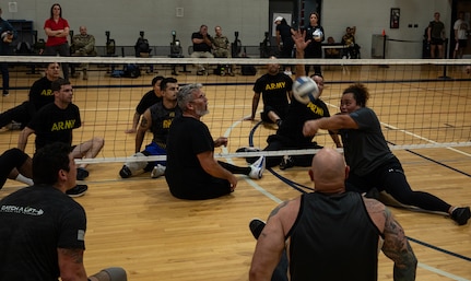 U.S. Army Cpl. Melesete Togio bumps the ball while competing in sitting volleyball at the 2024 Army Trials, Fort Liberty, North Carolina