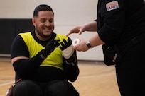 U.S. Army Spc. Janmiguel Torrescruz gets his hand taped before the wheelchair rugby event at the 2024 Army Trials, Fort Liberty, North Carolina
