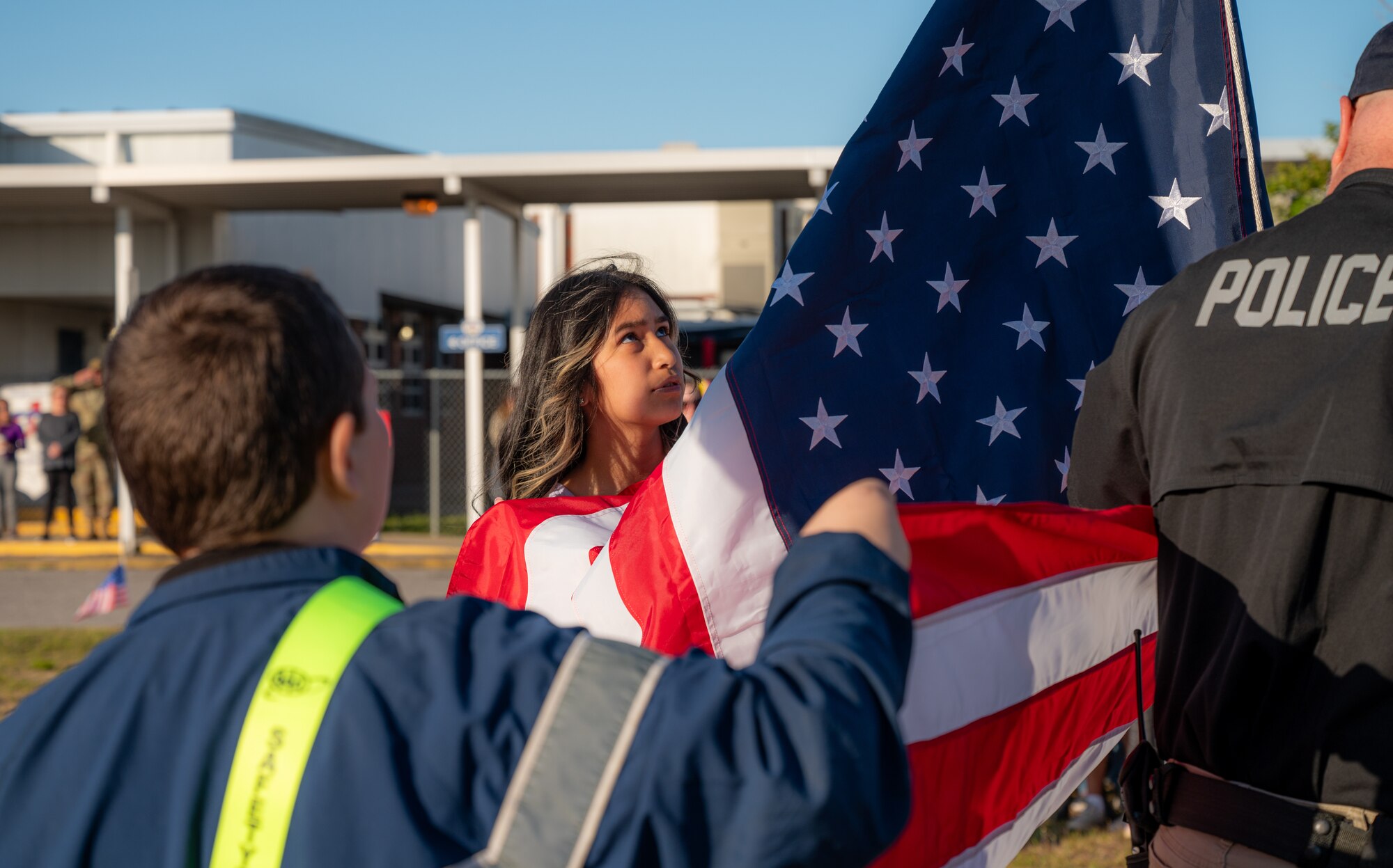 Children hold the American Flag