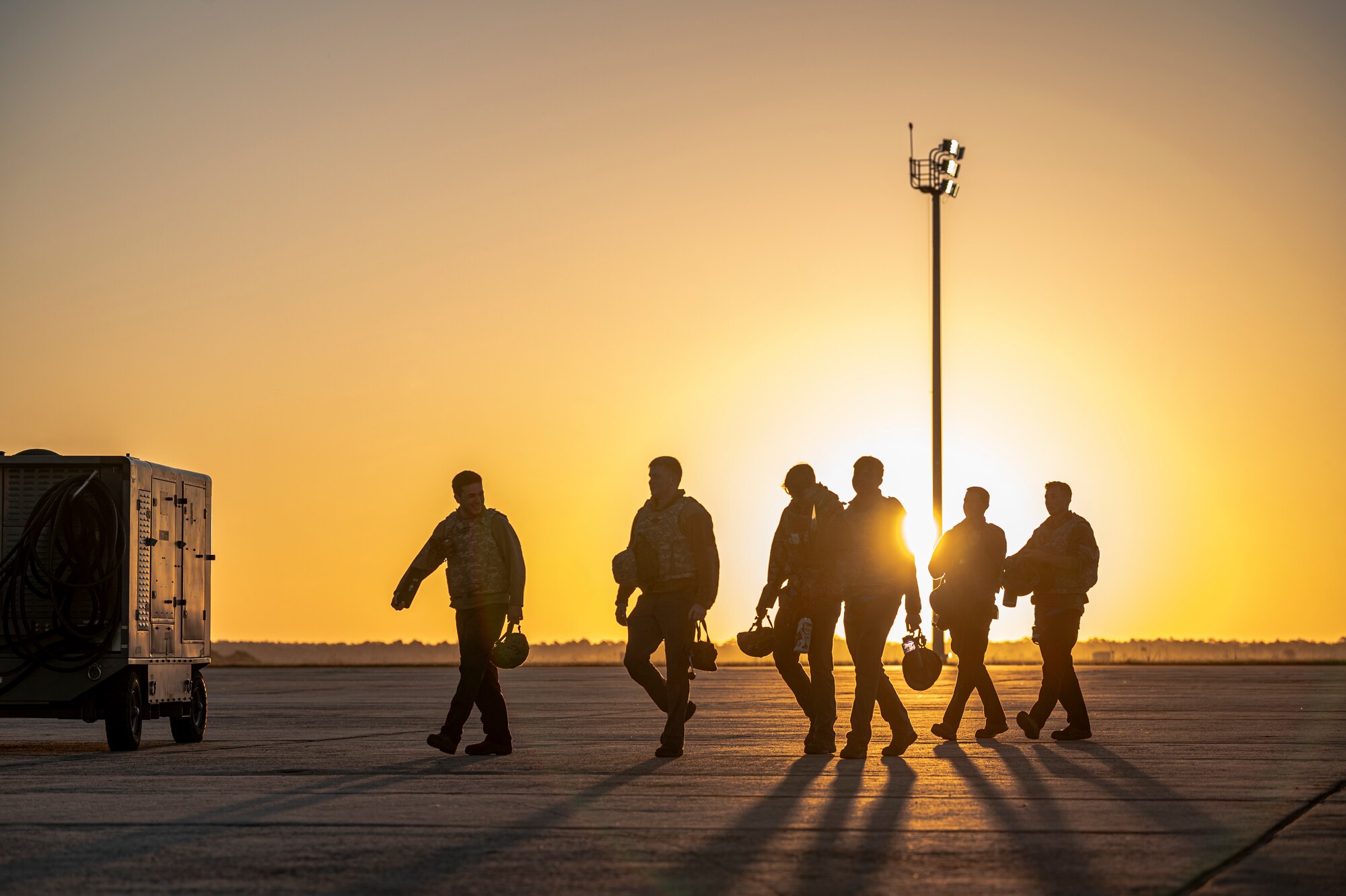 U.S. Air Force Airmen assigned to the 74th Fighter Generation Squadron walk on the flightline during Exercise Ready Tiger 24-1 at Avon Park Air Force Range, Florida, April 13, 2024. Crew chiefs ensure each aircraft is ready to execute the mission anytime, anywhere. Ready Tiger 24-1 is a readiness exercise demonstrating the 23rd Wing’s ability to plan, prepare and execute operations and maintenance to project air power in contested and dispersed locations, defending the United States’ interests and allies. (U.S. Air Force photo by Airman 1st Class Leonid Soubbotine)