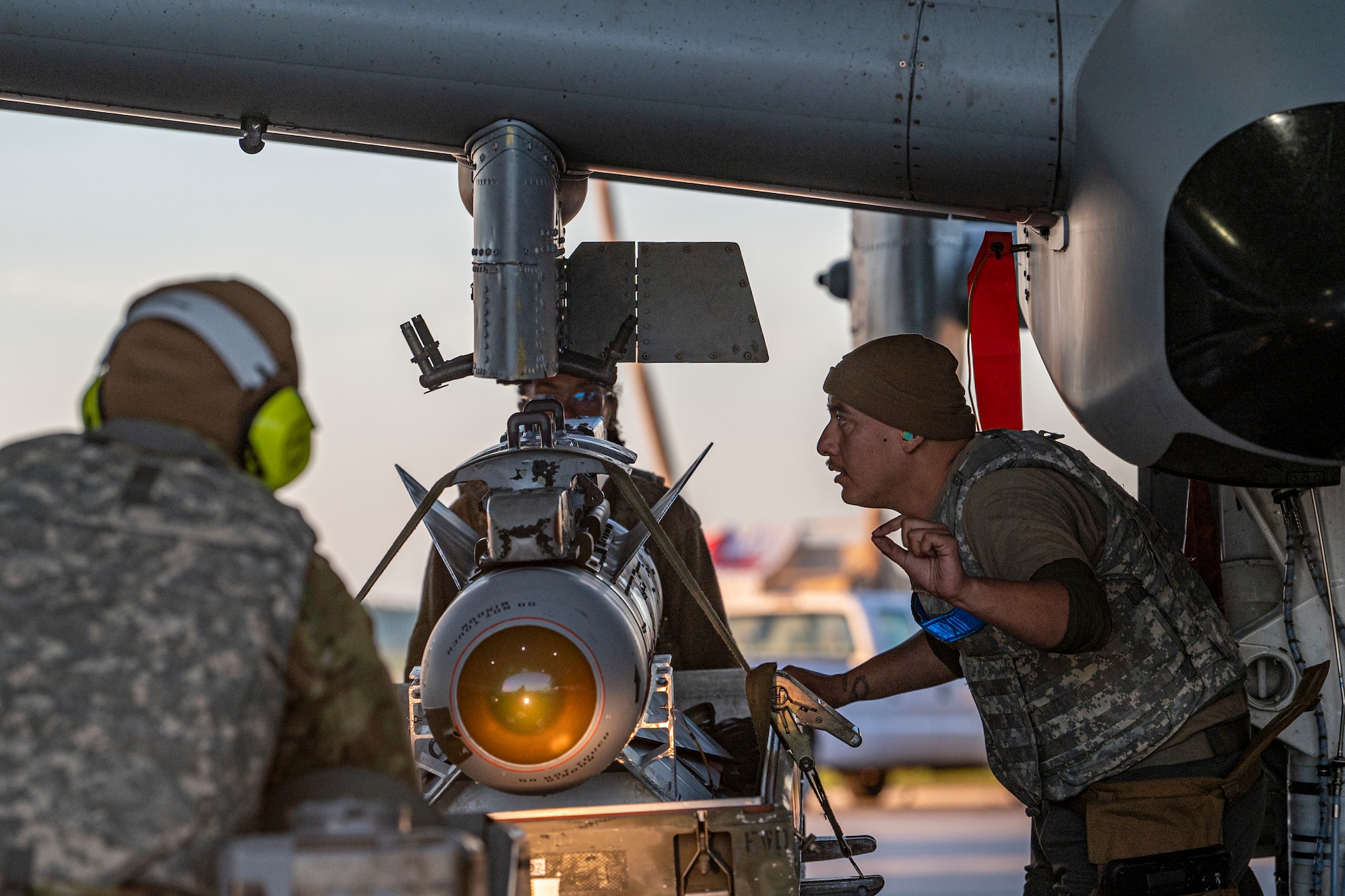 U.S. Air Force Airmen assigned to the 23rd Maintenance Group load a missile during Exercise Ready Tiger 24-1 at Avon Park Air Force Range, Florida, April 13, 2024. Weapons Airmen work hand-in-hand with crew chiefs to generate aircraft at a moment’s notice regardless of location. Ready Tiger 24-1 is a readiness exercise demonstrating the 23rd Wing’s ability to plan, prepare and execute operations and maintenance to project air power in contested and dispersed locations, defending the United States’ interests and allies. (U.S. Air Force photo by Airman 1st Class Leonid Soubbotine)