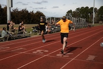 U.S. Army Lt. Col. Anthony Salazar, left, and U.S. Army veteran Patrick Dalton compete in the track event at the 2024 Army Trials, Fort Liberty, North Carolina