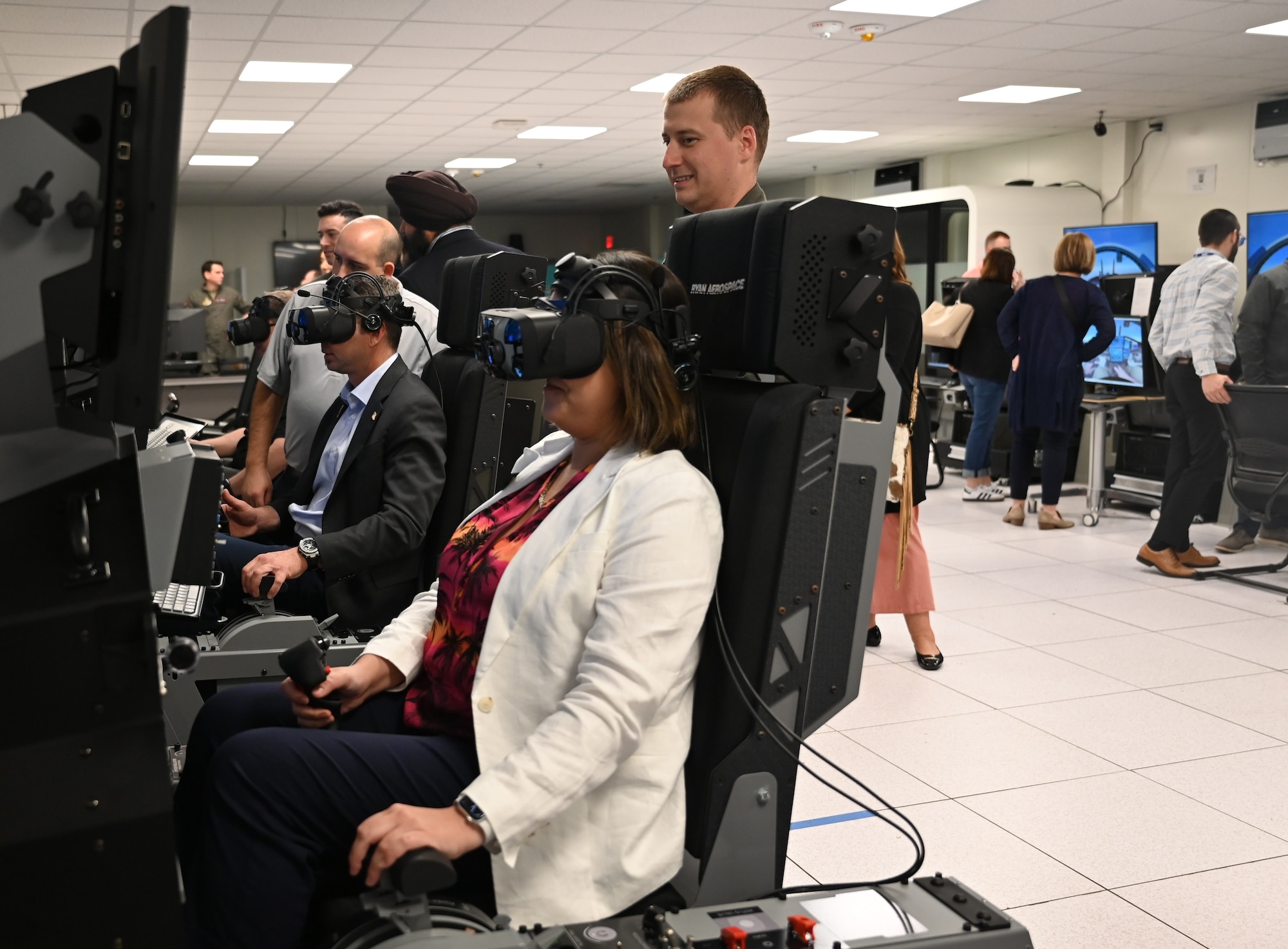 Council members try the pilot training simulators.