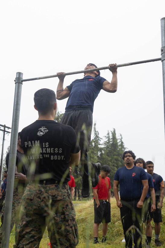 A U.S. Marine Corps poolee with Recruiting Sub-Station Modesto, Recruiting Station Sacramento, conducts pull-ups at Defense Depot San Joaquin Sharpe in Lathrop, Calif., April 13. The event was held to build esprit de corps and morale amongst the poolees. (U.S. Marine Corps photo by Sgt. Ryan Harvey)