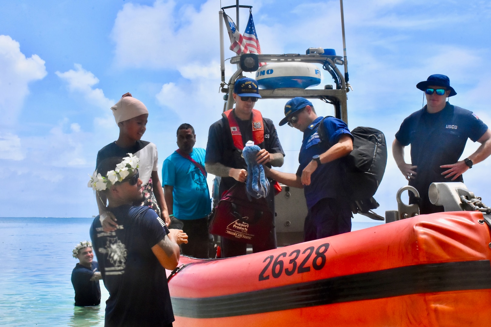 The crew of USCGC Oliver Henry (WPC 1140) arrive to Woleai, Yap State, Federated States of Micronesia, on April 12, 2024, with an injured 9-year-old boy and his parents for further transport aboard a Pacific Mission Aviation flight to a higher level of medical care in Yap. Upon arriving to Satawal to deliver drought relief supplies in partnership with USAID and the International Organization for Migration (IOM), the U.S. Coast Guard crew was informed of the boy's injury sustained when he fell from a tree. The ship's EMT, Petty Officer 1st Class Joshua Pablo, consulted a U.S. Coast Guard flight surgeon who recommended the medevac and provided care throughout the more than 13-hour overnight transit. This effort showcases the humanitarian spirit and readiness of the U.S. Coast Guard to respond to emergent health concerns. (U.S. Coast Guard photo)