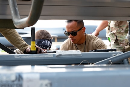 U.S. Air Force Tech. Sgt. Lesner Dimaoala, 9th Expeditionary Bomb Squadron crew chief, completes an engine swap on a B-1B Lancer at Morón Air Base, Spain, April 3, 2024, during Bomber Task Force Europe. Regular and routine deployments of strategic bombers provide the U.S. with critical skills to train and operate alongside Allies and partners while bolstering collective response to global conflict. (U.S. Air Force photo by Airman 1st Class Emma Anderson)