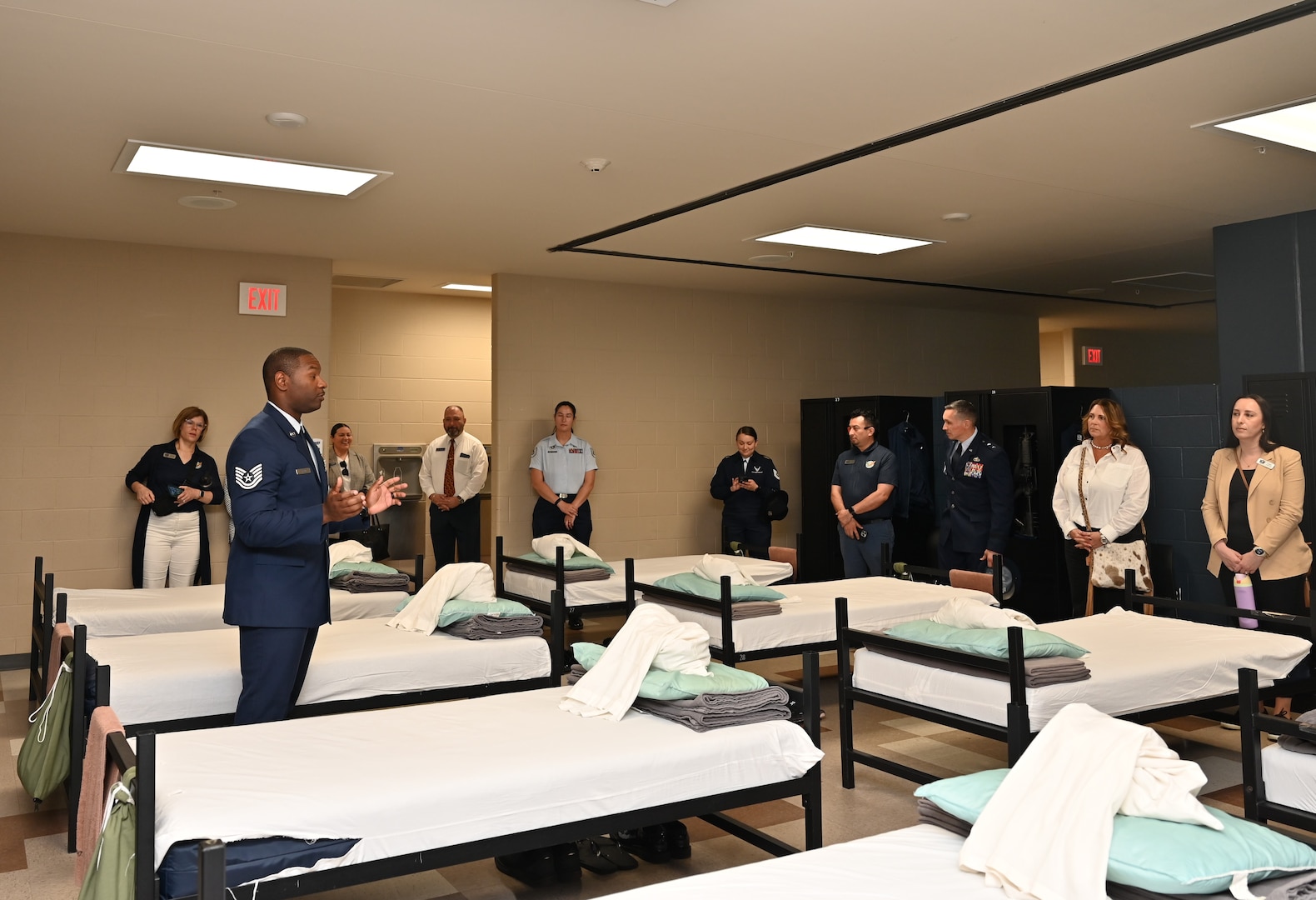A technical instructor shows the council the Airmen's sleeping quarters.