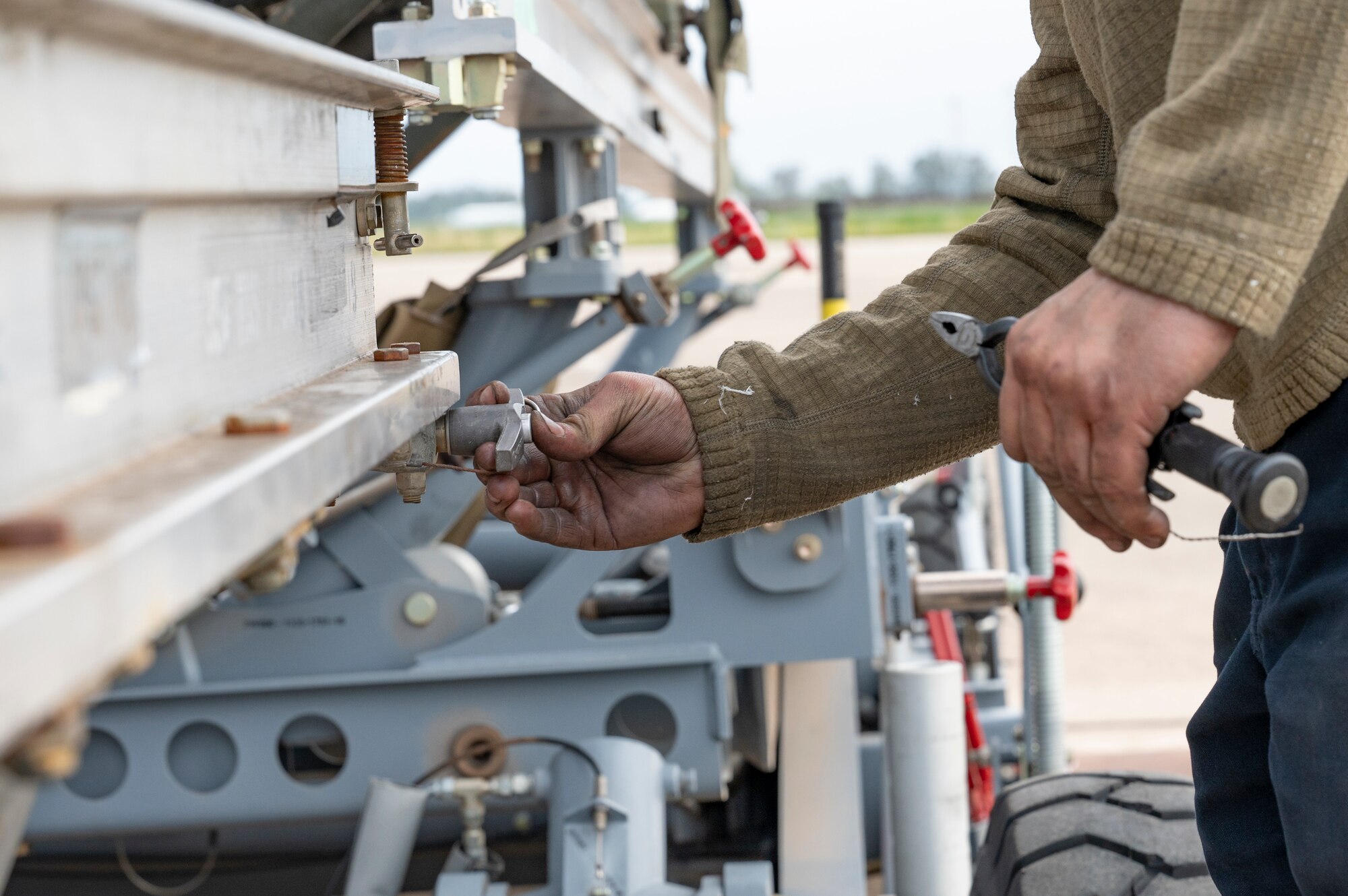 A maintenance airman assigned to the 9th Expeditionary Bomb Squadron from Dyess Air Force Base, Texas, completes an engine swap on a B-1B Lancer at Morón Air Base, Spain, April 3, 2024, during Bomber Task Force Europe. The ability to perform heavy maintenance in a deployed environment demonstrates crews can maintain a high state of readiness and proficiency. (U.S. Air Force photo by Airman 1st Class Emma Anderson)
