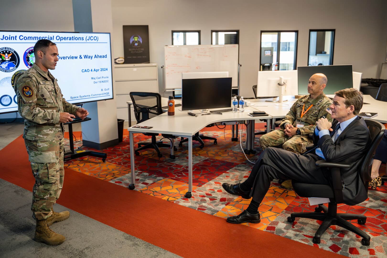 man briefing two men