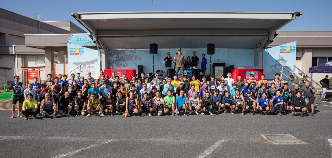 Participants in the 35th Marine Corps Air Station Iwakuni Sprint Triathlon pose for a group photo at MCAS Iwakuni, Japan, April 14, 2024. The annual MCAS Iwakuni Sprint Triathlon is held to strengthen relationships with the local community and Marine Corps personnel, it included a 350-meter swim, 16k bike ride, and a 5k run. (U.S. Marine Corps photo by Lance Cpl. Dahkareo Pritchett)