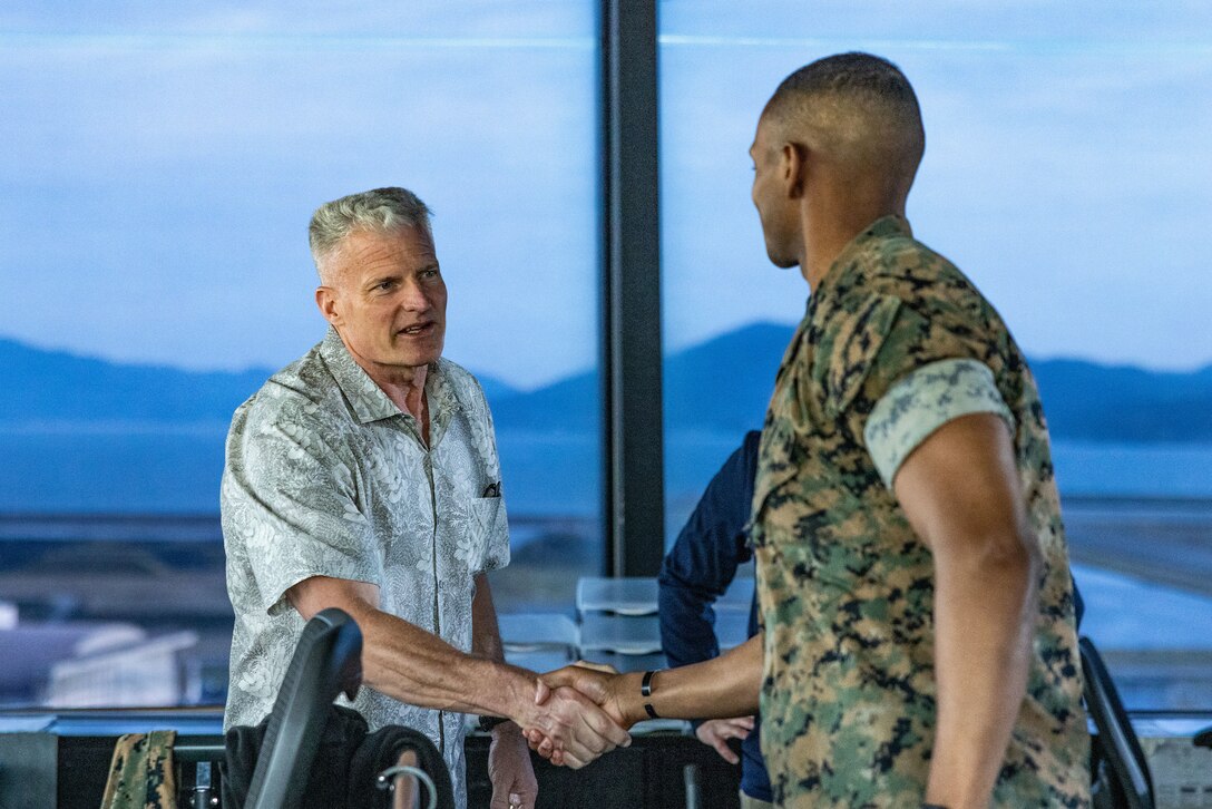 U.S. Marine Corps Lt. Gen. Roger B. Turner, the commanding general of III Marine Expeditionary Force, and a Maryland native, shakes hands with a 1stLt. Rynel Marshall, an air traffic control officer with Headquarters and Headquarters squadron Marine Corps Air Station Iwakuni, and an Alabama native, during a tour of the MCAS, air traffic control tower at Marine Corps Air Station Iwakuni, Japan, Apr. 10, 2024.   Leadership of III MEF visited the Marines of MCAS Iwakuni to recognize their hard work and dedication to the Marine Corps’ mission in the Indo-Pacific. (U.S. Marine Corps photo by Cpl. Calah Thompson)