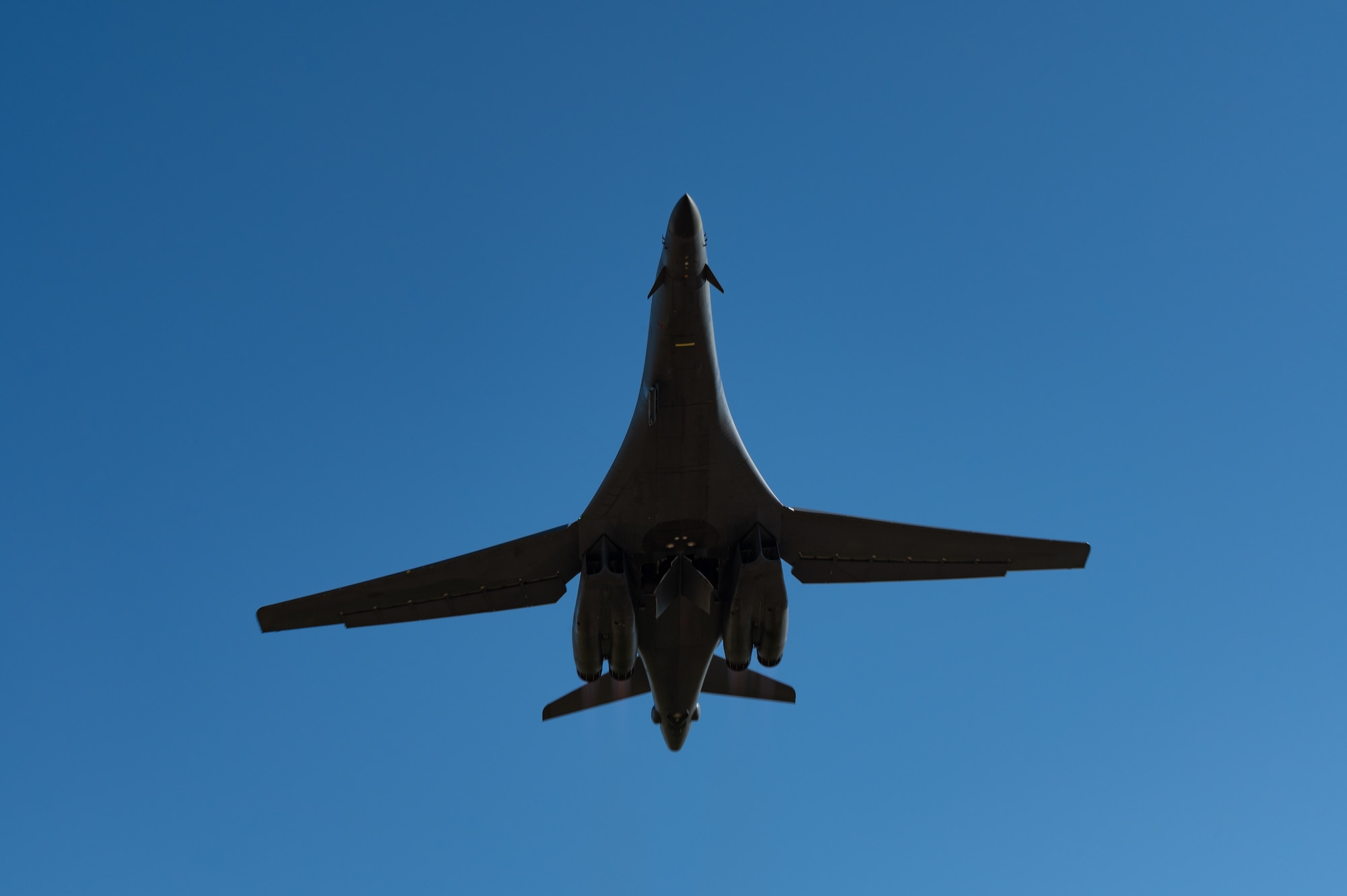 A U.S. Air Force B-1B Lancer flies overhead