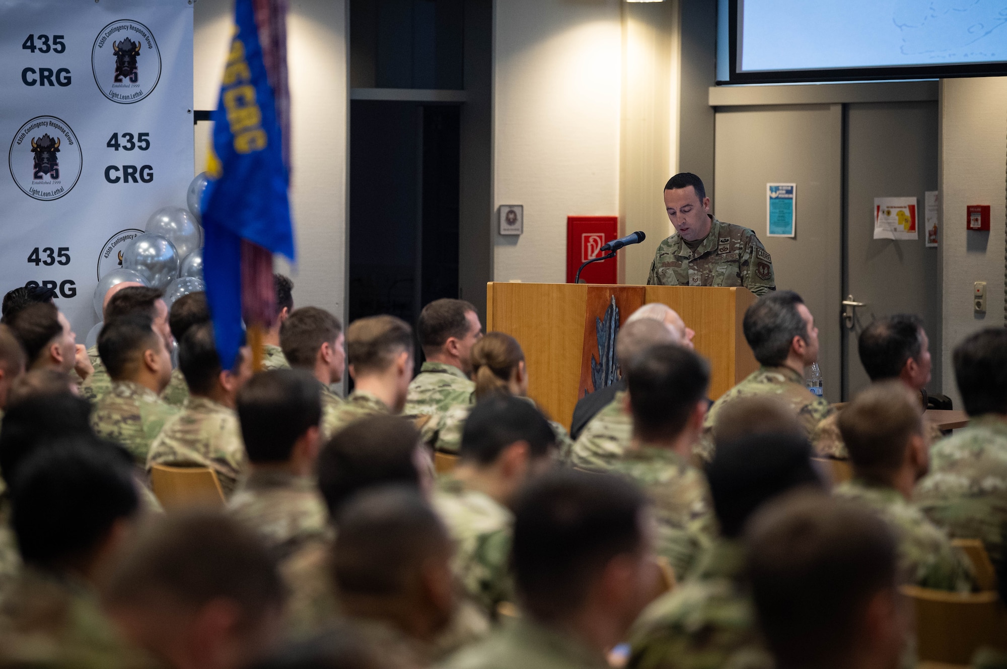 U.S. Air Force Tech. Sgt. Matt Clark, 435th Construction and Training Squadron power production contingency instructor, briefs Airmen assigned to the 435th Contingency Response Group on the history of the unit, at Ramstein Air Base, Germany, Feb. 26, 2024. Established on February 26th, 1999, the 435th CRG marked a significant milestone as it celebrated its 25th anniversary. (U.S. Air Force photo by Senior Airman Jared Lovett)
