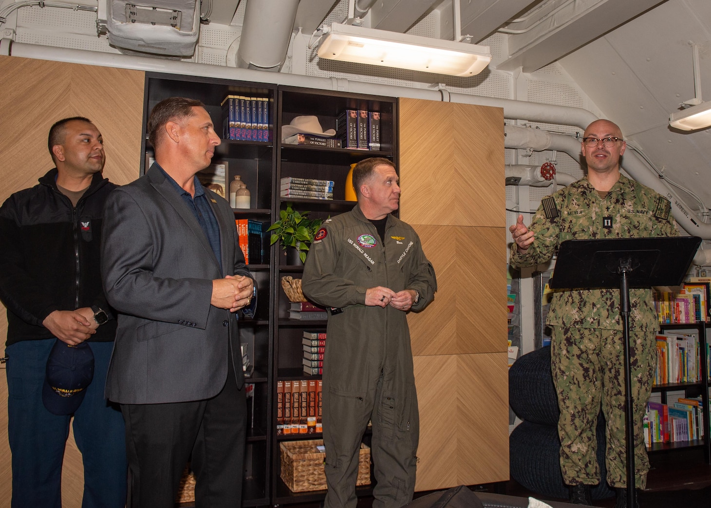 Lt. Jacob Meyers, right, a Navy chaplain, speaks during the opening of a ship-based United Service Operations (USO) center aboard the U.S. Navy’s only forward-deployed aircraft carrier, USS Ronald Reagan (CVN 76), while in-port Commander, Fleet Activities Yokosuka, April 17. Ronald Reagan, the flagship of Carrier Strike Group 5, provides a combat-ready force that protects and defends the United States, and supports alliances, partnerships and collective maritime interests in the Indo-Pacific region.
