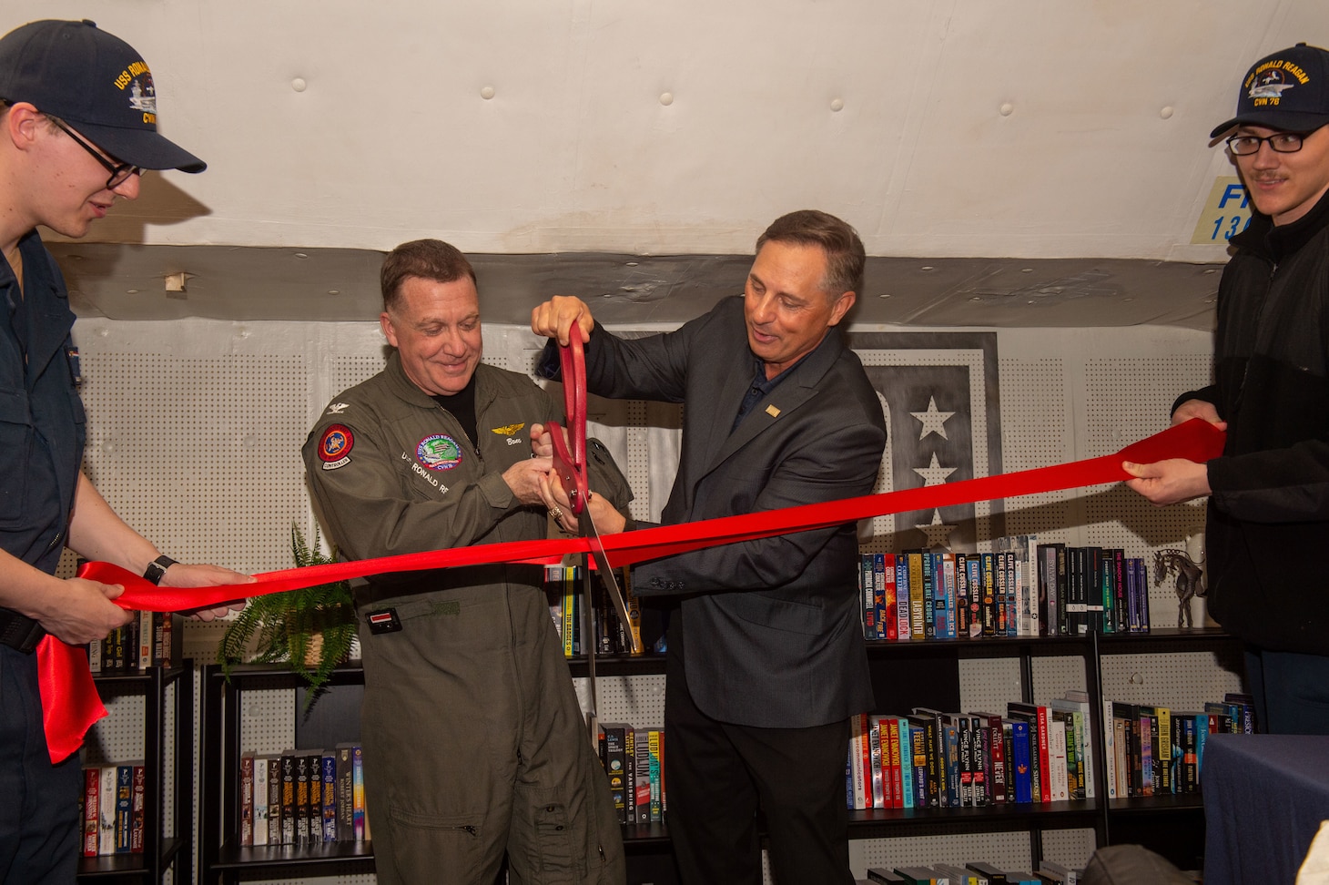 Capt. Daryle Cardone, commanding officer of the U.S. Navy’s only forward-deployed aircraft carrier, USS Ronald Reagan (CVN 76), and Scott Maskery, regional vice president for the United Service Operations (USO) Indo-Pacific regional office, cut a ribbon to signify the opening of a ship-based USO center aboard the ship while in-port Commander, Fleet Activities Yokosuka, April 17. Ronald Reagan, the flagship of Carrier Strike Group 5, provides a combat-ready force that protects and defends the United States, and supports alliances, partnerships and collective maritime interests in the Indo-Pacific region.
