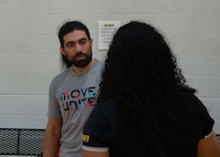 U.S. Army veteran Sgt. Justin Mathers converses with another athlete during the powerlifting event at the 2024 Army Trials Powerlifting event at Hercules Physical Fitness Center, Fort Liberty, North Carolina