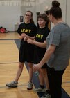 U.S. Army Spc. Brooke Jader, left, and U.S. Army 1st Lt. Hannah Wright, right, encourage fellow athletes during the powerlifting event at the 2024 Army Trials, Fort Liberty, North Carolina