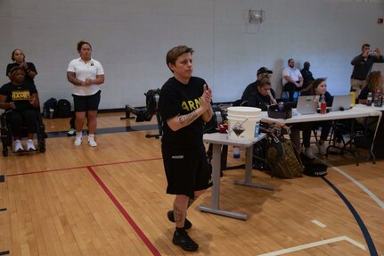 U.S. Army Sgt. 1st Class Stacy Englert encourages fellow athletes during the powerlifting event at the 2024 Army Trials, Fort Liberty, North Carolina
