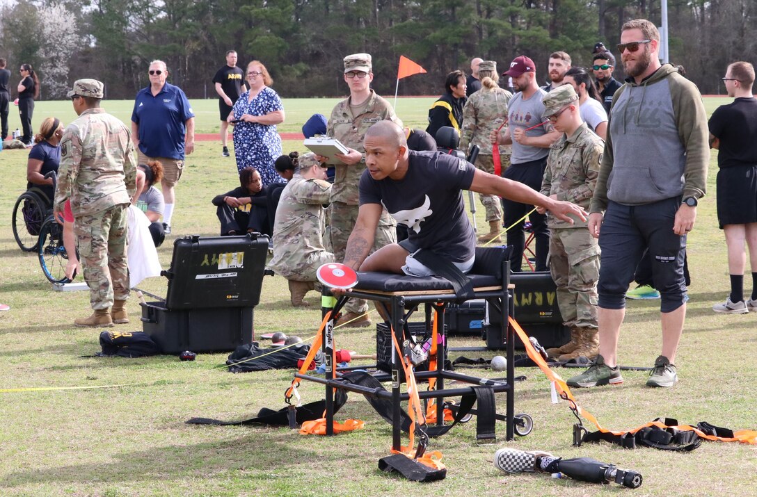 U.S. Army veteran Staff Sgt. Gene Calantoc prepares to throw the discus during the field event at the Army Trials, Fort Liberty, North Carolina