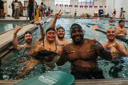 Team Army athletes pose for a photo during the swim event at the 2024 Army Trials, Fort Liberty, North Carolina