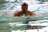 U.S. Army veteran Spc. Michael Villagran glides toward the first turn during the swimming event at the Army Trials, Fort Liberty, North Carolina
