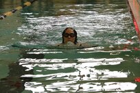 U.S. Army 1st Lt. Hannah Wright breaks the surface executing the breaststroke during the swimming event at the Army Trials, Fort Liberty, North Carolina