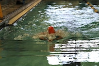 U.S. Army veteran Chief Warrant Officer 5 Richard McCormick makes a beeline to the first turn during the swimming event at the Army Trials, Fort Liberty, North Carolina