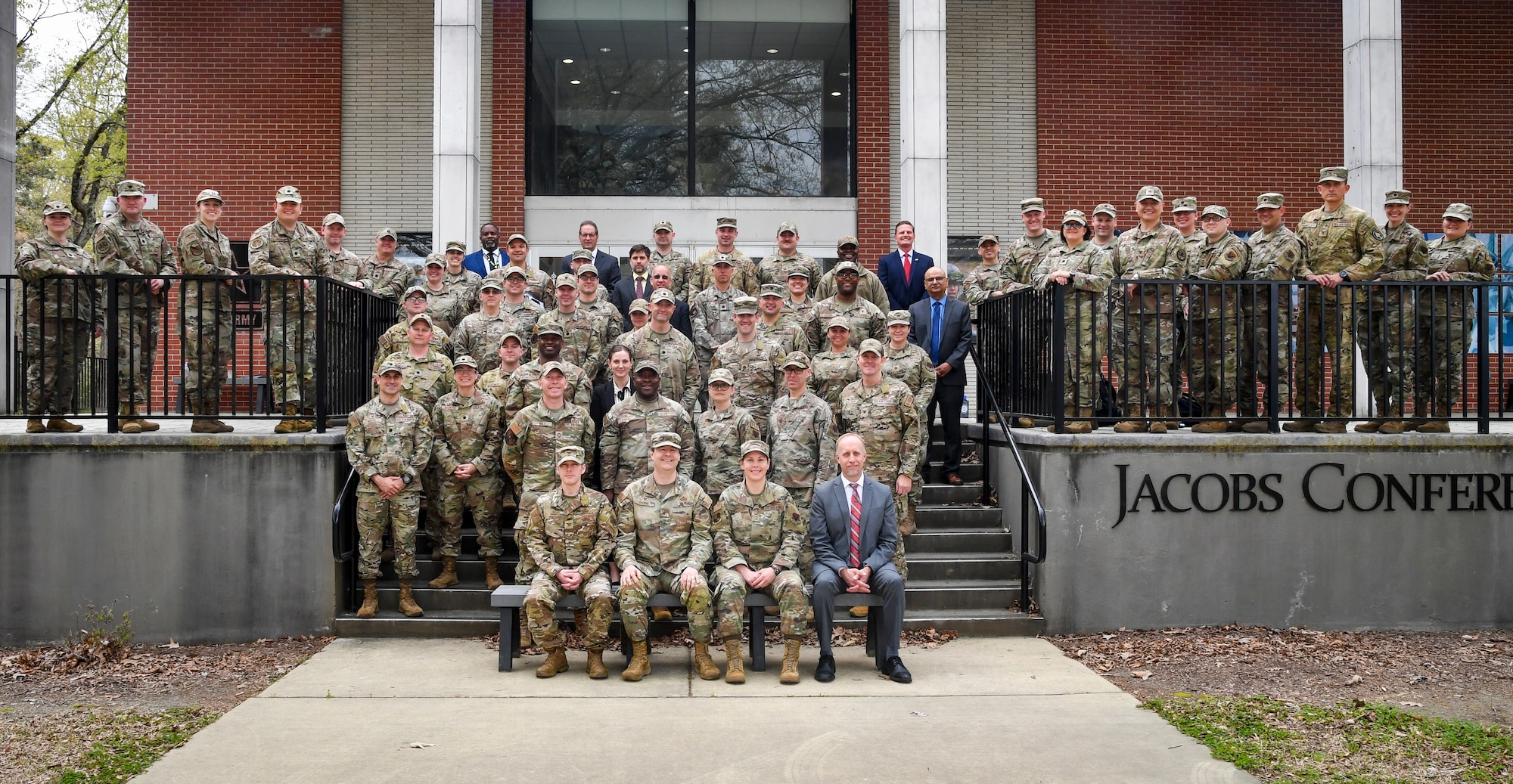 Large group of people pose for a group photo.